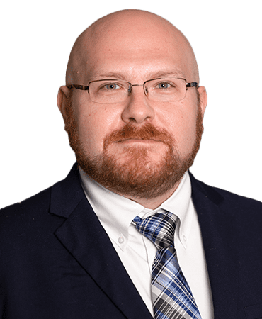 Man in suit with blue patterned tie