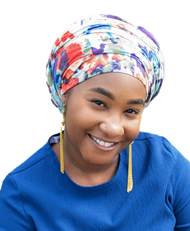 Smiling woman wearing a headscarf and earrings.