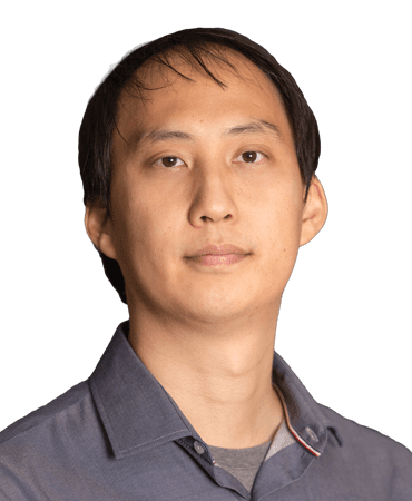 Headshot of a man in a grey shirt.