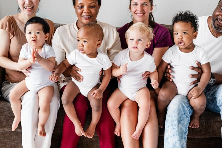 Diverse babies with their parents