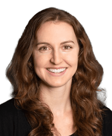 Woman with long brown hair smiling.