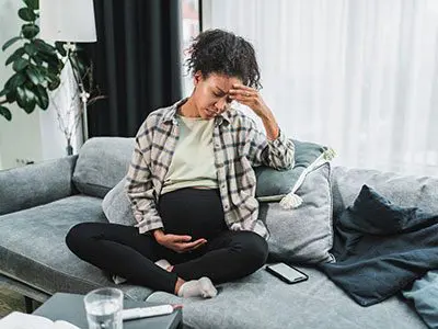 Worried pregnant woman to illustrate news blog
