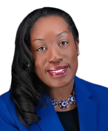 Woman in blue blazer with necklace smiling.