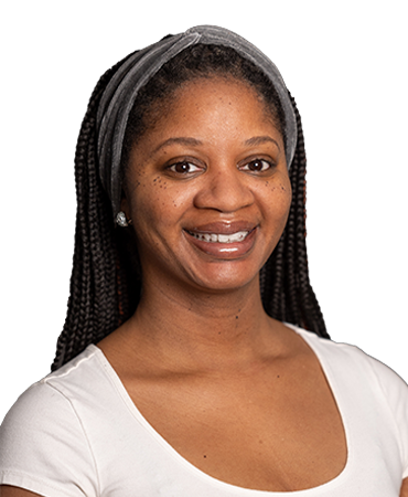 Woman with gray headband smiling.