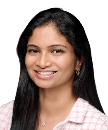 Portrait of a smiling woman with long dark hair and earrings.