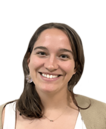 Smiling woman with long brown hair and earrings.