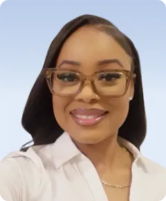 Smiling person wearing glasses and a shirt.