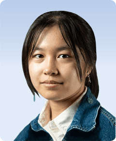 Young woman with long hair, blue jacket.
