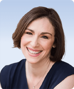 Smiling woman with short brown hair.