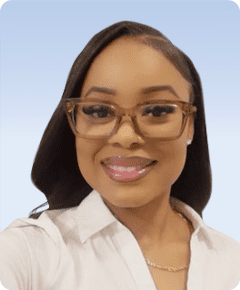 Smiling person with glasses and white shirt.