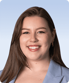 Smiling woman in blue blazer portrait.