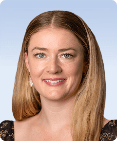 Smiling woman with long blonde hair.