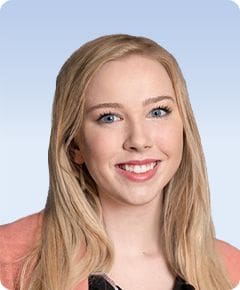 Smiling woman with long blonde hair.