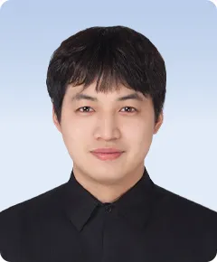 Portrait of a person in black shirt.