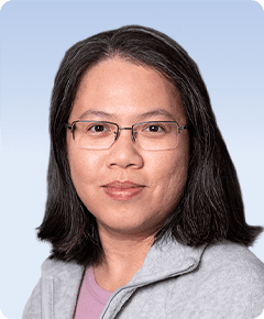 Person with glasses and shoulder-length hair.