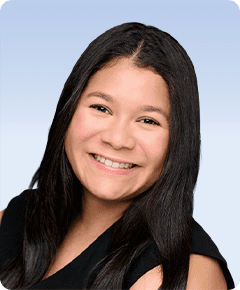 Smiling woman with long dark hair.