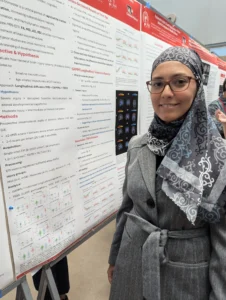 Attendee wearing patterned hijab at poster session