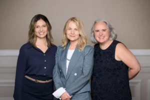 Group portrait of three women in business attire