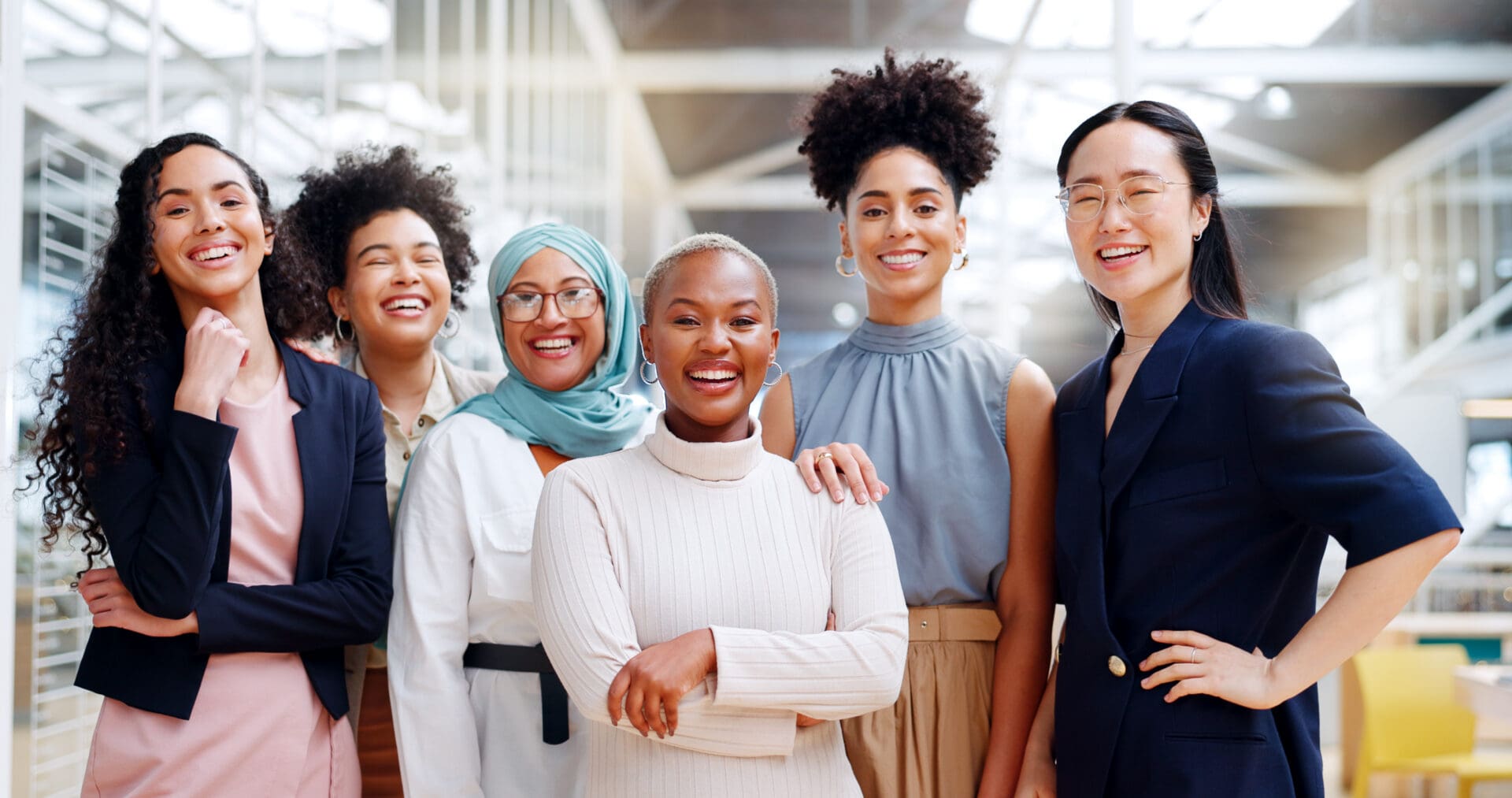 Diverse professional women smiling in modern office