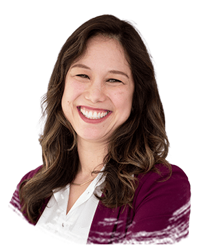 Smiling woman headshot wearing maroon blazer