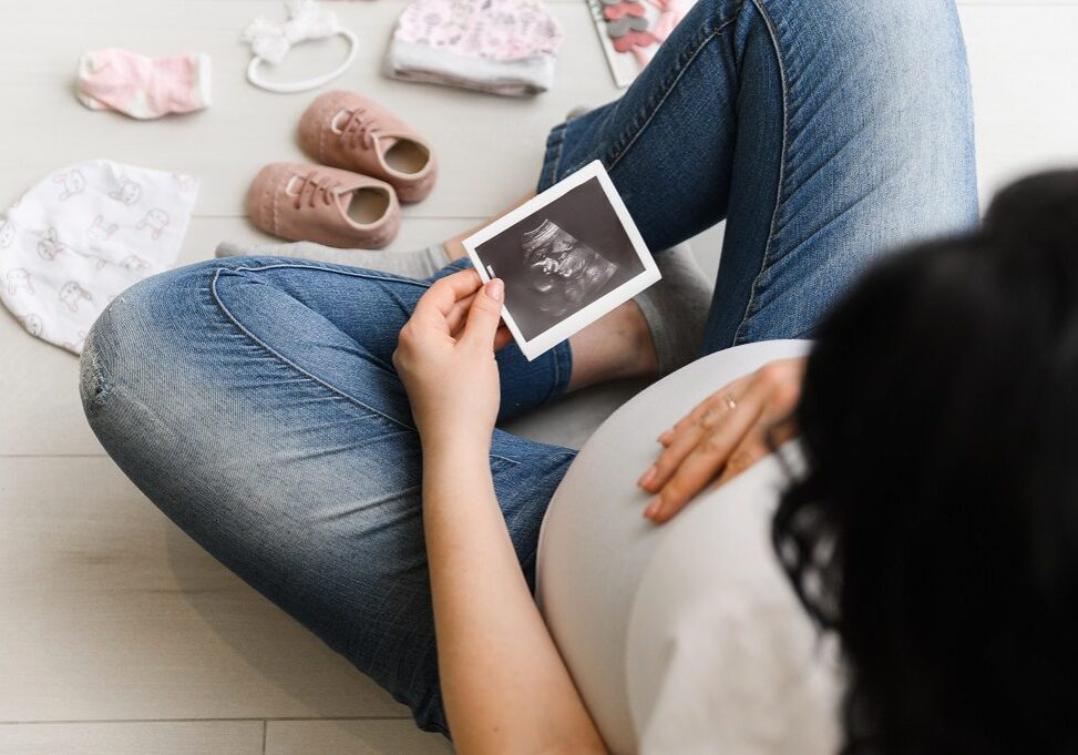 Pregnant Woman Enjoying Future Motherhood With Her Baby's First