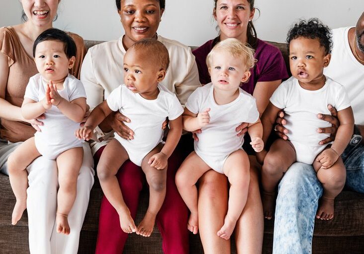 Diverse babies with their parents