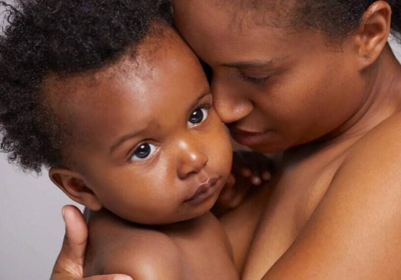 Mother holding baby in tender embrace